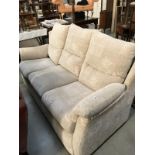 A cream fabric 3 seater settee