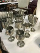 A quantity of pewter goblets and tankard