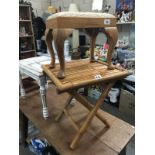 A cane side table and a foot stool on Queen Anne legs