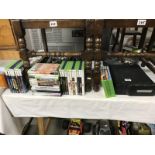 An X-Box and a lot of X-box games etc.