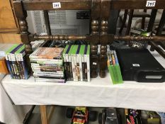 An X-Box and a lot of X-box games etc.