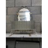 A vintage painted wrought iron framed mirror and a magazine rack