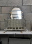 A vintage painted wrought iron framed mirror and a magazine rack