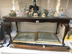 A leather and glass topped coffee table