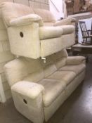 A cream 3 seater and 2 seater sofa with recliner