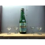 A large Babycham money bank in shape of a bottle and 4 Babycham glasses