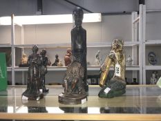 A quantity of wooden figures including tribal, knights etc.