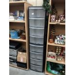 2 sets of 4 drawer plastic storage units