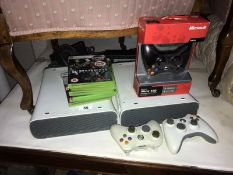 2 X-Box 360 games consoles and quantity of games
