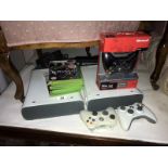 2 X-Box 360 games consoles and quantity of games