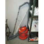 A Vax hoover/washer vacuum and a Bissell magic broom
