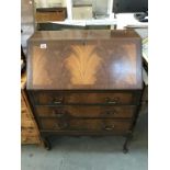 A 1930's flame mahogany veneered bureau