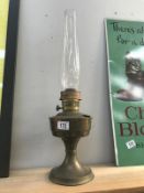 A brass oil lamp with chimney