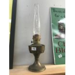 A brass oil lamp with chimney