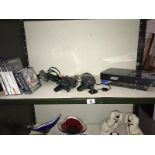 A Playstation 2 and a quantity of Playstation games etc.