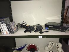 A Playstation 2 and a quantity of Playstation games etc.