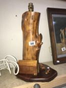 An unusual carved wooden table lamp base with house, deckchair,