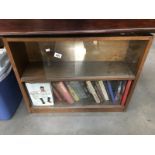 A 1950's oak bookcase and contents