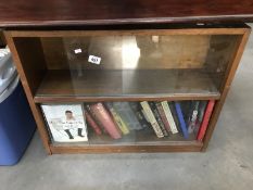 A 1950's oak bookcase and contents