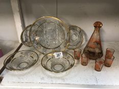 A Mary Gregory style decanter and glasses and a vintage dessert bowl and dishes