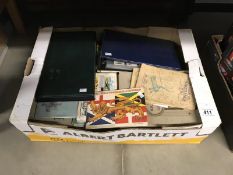 A box of cigarette and trade card albums