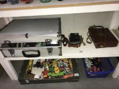A quantity of cameras and accessories including a Kodak folding brownie and a cine camera