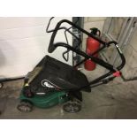 A Qualcast Briggs & Stratton petrol lawn mower