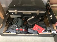 A box of cameras and accessories