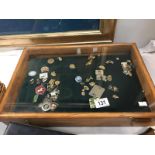 A display case of pin badges