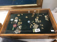 A display case of pin badges