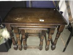 A 1950's oak nest of tables