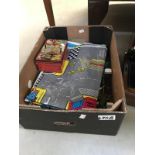 A box of die cast cars & old money box etc.