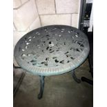 A verdigree finished plastic garden table