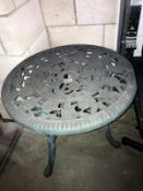 A verdigree finished plastic garden table
