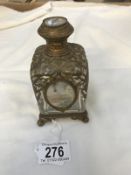 A French perfume bottle with filigree and picture panels