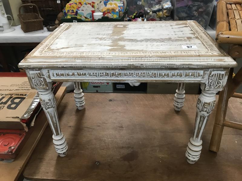 A shabby chic painted coffee table