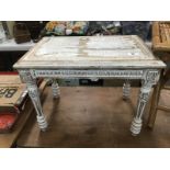 A shabby chic painted coffee table