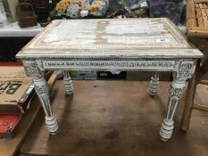 A shabby chic painted coffee table