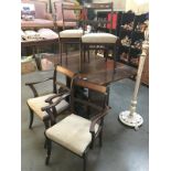 A set of 4 darkwood chairs with brass inlay to back