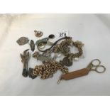 A mixed lot including silver fobs, yellow metal chains etc.