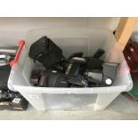 A box of cameras and accessories