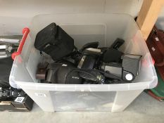 A box of cameras and accessories