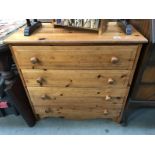 A solid pine chest of drawers