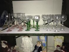 11 green stemmed wine glasses,