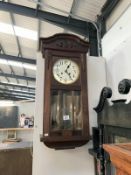 A 1930's oak wall clock