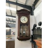 A 1930's oak wall clock