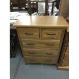 A solid oak chest of drawers