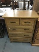 A solid oak chest of drawers