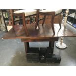 A 1950's oak drawleaf table