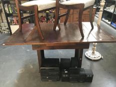 A 1950's oak drawleaf table